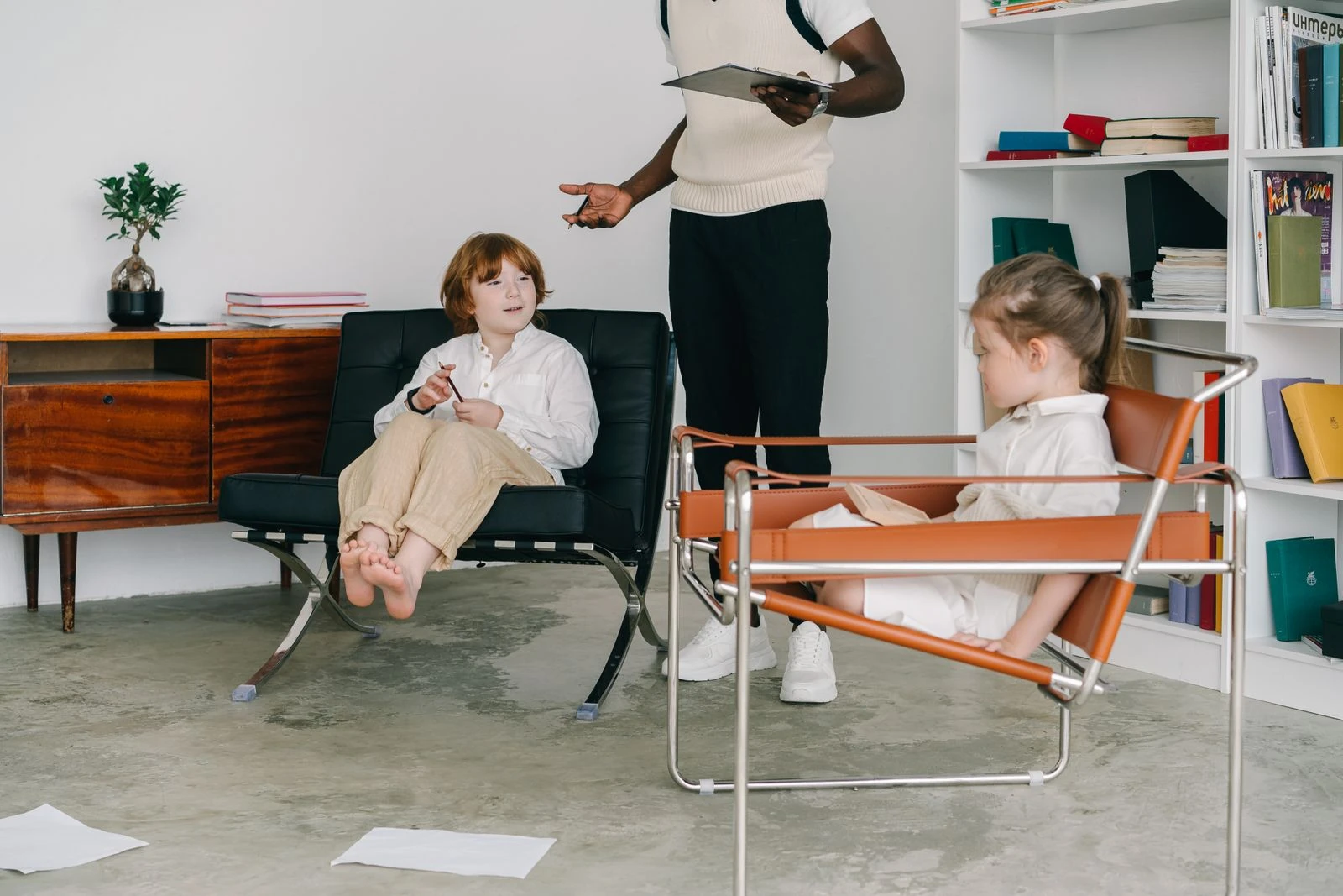 Two children with an adult during a play based session